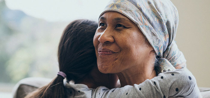 Photo of grandmother hugging her grandaughter. Photo of grandmother hugging her grandaughter.