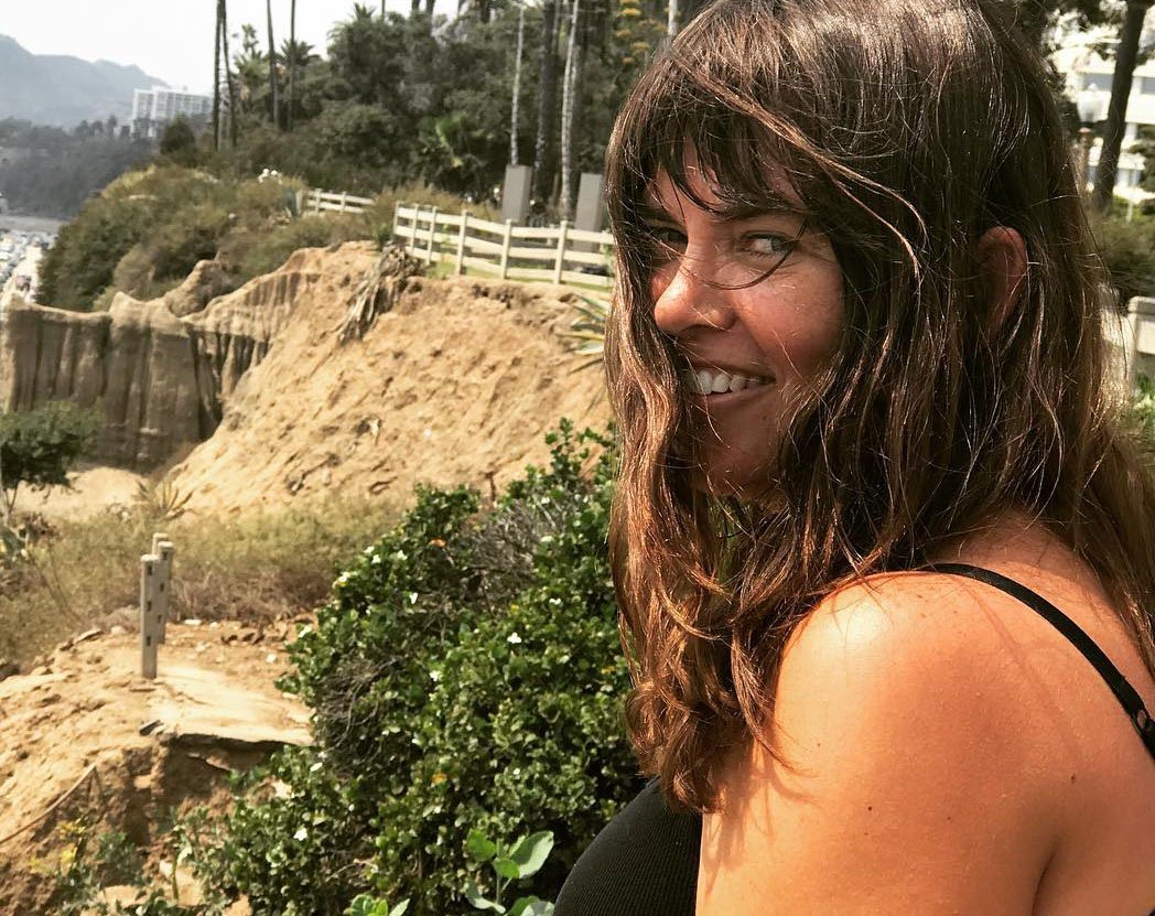 Photo of Nicole Follin near the ocean.