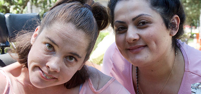 Photo of two ladies at a disability rally. Photo of two ladies at a disability rally.